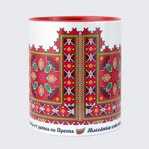 A cup decorated with embroidery from a Prespa embroidery